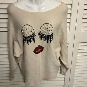 Italian Cream Sweater with Embellished Face Design